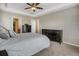 Bedroom featuring a tray ceiling, neutral paint, carpeted floors, and a large bed at 3810 Cadence Dr, Castle Rock, CO 80109
