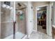 Tiled walk-in shower with a glass door in the main bathroom, plus a door to the closet at 3810 Cadence Dr, Castle Rock, CO 80109