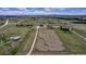 Aerial view of property showcasing land, well-maintained pastures, and a farm house at 35427 Welch Trl, Elizabeth, CO 80107