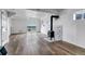 Spacious finished basement with wood-look flooring, wood burning stove, and sliding glass doors at 35427 Welch Trl, Elizabeth, CO 80107