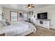 Spacious bedroom with built-in shelving, neutral decor, and ample natural light at 35427 Welch Trl, Elizabeth, CO 80107