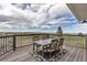 Back deck with outdoor dining set perfect for entertaining and enjoying the view at 35427 Welch Trl, Elizabeth, CO 80107