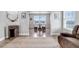 Bright dining room with large windows, a rustic dining table, and natural light, perfect for Gathering meals at 35427 Welch Trl, Elizabeth, CO 80107