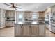 Bright kitchen with island, stainless appliances, and ample storage space at 35427 Welch Trl, Elizabeth, CO 80107