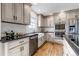 Stylish kitchen featuring stainless appliances, a farmhouse sink, and bright countertops at 35427 Welch Trl, Elizabeth, CO 80107