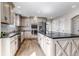 Well-equipped kitchen featuring a large island, stainless appliances, and cabinetry at 35427 Welch Trl, Elizabeth, CO 80107