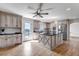 Bright kitchen with island, stainless appliances, and access to a deck at 35427 Welch Trl, Elizabeth, CO 80107