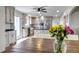 Open floor plan shows the kitchen with an island and stainless appliances at 35427 Welch Trl, Elizabeth, CO 80107