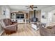 Inviting living room with wood-burning stove and custom built-in entertainment center at 35427 Welch Trl, Elizabeth, CO 80107