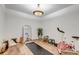 Bright exercise room with yoga mat, exercise bike, and a stylish chandelier at 35427 Welch Trl, Elizabeth, CO 80107