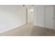 A bedroom featuring a closet with white doors and neutral carpet at 912 S Yampa St # 203, Aurora, CO 80017