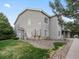 A charming two-story home with light grey siding and a well-maintained lawn, creating a welcoming curb appeal at 912 S Yampa St # 203, Aurora, CO 80017