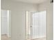 Bright hallway leading to an open closet and a bathroom at 912 S Yampa St # 203, Aurora, CO 80017