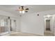 Bright living room features a sliding glass door to the balcony and neutral carpeting at 912 S Yampa St # 203, Aurora, CO 80017