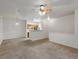 Open-concept living space showcasing seamless transition to the kitchen at 912 S Yampa St # 203, Aurora, CO 80017