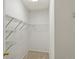 A carpeted walk-in closet with wire shelving along the walls at 912 S Yampa St # 203, Aurora, CO 80017