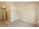 Bedroom with neutral walls, carpet, and a closet with sliding doors at 2896 W Riverwalk Cir # 204, Littleton, CO 80123