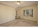 Bedroom featuring a balcony, carpet floors, and a large window at 2896 W Riverwalk Cir # 204, Littleton, CO 80123
