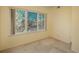 Bright bedroom features a large window with scenic outdoor views at 2896 W Riverwalk Cir # 204, Littleton, CO 80123