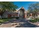 Exterior view of the building with attractive landscaping and circle driveway at 2896 W Riverwalk Cir # 204, Littleton, CO 80123