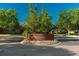 Attractive brick sign for the 'Riverwalk Clubhouse' is surrounded by landscaping and well kept lawns at 2896 W Riverwalk Cir # 204, Littleton, CO 80123