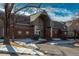 Exterior of the Riverwalk Clubhouse with a modern entrance and well-maintained landscaping at 2896 W Riverwalk Cir # 204, Littleton, CO 80123