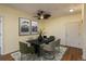 Modern dining area featuring a table, stylish chairs, decorative artwork and ceiling fan at 2896 W Riverwalk Cir # 204, Littleton, CO 80123