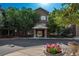 Attractive brick building with well-maintained landscaping and inviting entrance at 2896 W Riverwalk Cir # 204, Littleton, CO 80123