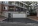 Exterior view of a condo building with an attached garage at 2896 W Riverwalk Cir # 204, Littleton, CO 80123