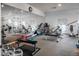 Well-equipped gym with weights, cardio machines, and mirrored walls for a complete workout experience at 2896 W Riverwalk Cir # 204, Littleton, CO 80123