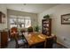 The common room provides comfortable seating and a table for group activities at 2896 W Riverwalk Cir # 204, Littleton, CO 80123