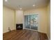 Living room with fireplace and sliding glass doors to balcony at 2896 W Riverwalk Cir # 204, Littleton, CO 80123