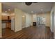 Living room with fireplace, sliding door, and kitchen at 2896 W Riverwalk Cir # 204, Littleton, CO 80123