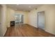 Living room featuring a fireplace, hardwood floors, and a balcony at 2896 W Riverwalk Cir # 204, Littleton, CO 80123