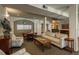 Relaxing common area features various seating arrangements and neutral decor at 2896 W Riverwalk Cir # 204, Littleton, CO 80123
