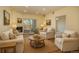 Cozy living room features a fireplace, plush seating, a sliding glass door and bright neutral paint at 2896 W Riverwalk Cir # 204, Littleton, CO 80123