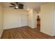 Open concept living room with hardwood floors and a ceiling fan at 2896 W Riverwalk Cir # 204, Littleton, CO 80123