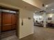 The common area features neutral tile floors, seating, and elevator access at 2896 W Riverwalk Cir # 204, Littleton, CO 80123
