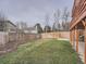 Landscaped backyard with a wooden fence and grassy area at 2368 W 119Th Ave, Denver, CO 80234