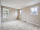 Spacious bedroom with neutral carpet and large windows at 2368 W 119Th Ave, Denver, CO 80234