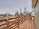 Wooden deck with railing offering backyard and neighborhood views at 2368 W 119Th Ave, Denver, CO 80234