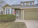 House exterior showcasing a two-car garage and manicured lawn at 2368 W 119Th Ave, Denver, CO 80234