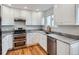 Renovated kitchen, featuring stainless steel appliances and granite countertops at 2368 W 119Th Ave, Denver, CO 80234