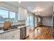 Kitchen with stainless steel appliances and access to a deck at 2368 W 119Th Ave, Denver, CO 80234