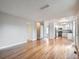 Open living room with hardwood floors and access to kitchen at 2368 W 119Th Ave, Denver, CO 80234