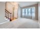 Bright living room featuring hardwood floors and a staircase at 2368 W 119Th Ave, Denver, CO 80234
