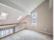 Bright loft area with skylights and wood railing overlooking lower level at 2368 W 119Th Ave, Denver, CO 80234