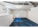 Spacious unfinished basement with laundry appliances and textured walls at 1215 Jackson St, Denver, CO 80206