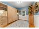 Bedroom with storage cabinet, hardwood floors, and ample natural light at 1215 Jackson St, Denver, CO 80206