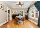 Stylish dining room featuring hardwood floors, a ceiling fan, and natural light at 1215 Jackson St, Denver, CO 80206